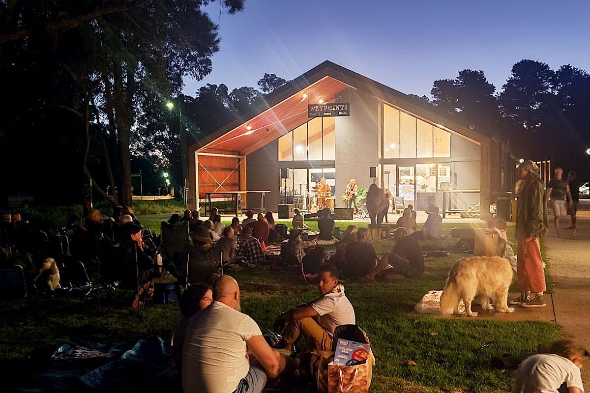 People sitting in the alfresco for Live on the Lawn music event at Waypoints Cafe in Dwellingup