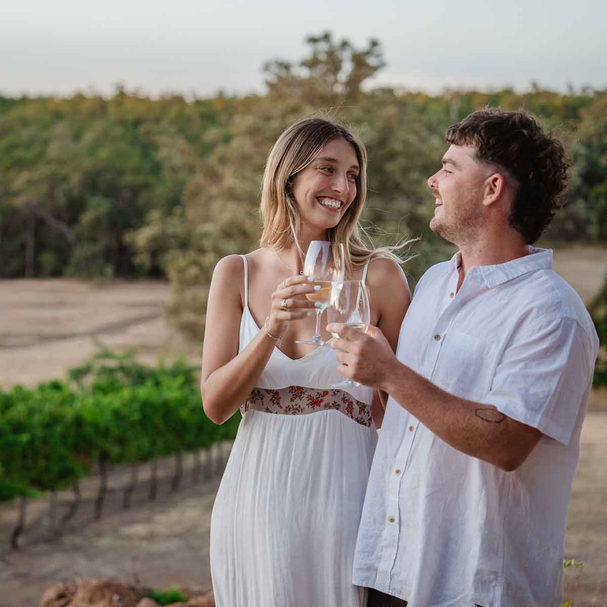 Young couple smiling at Redgum Wine Estate in Dwellingup