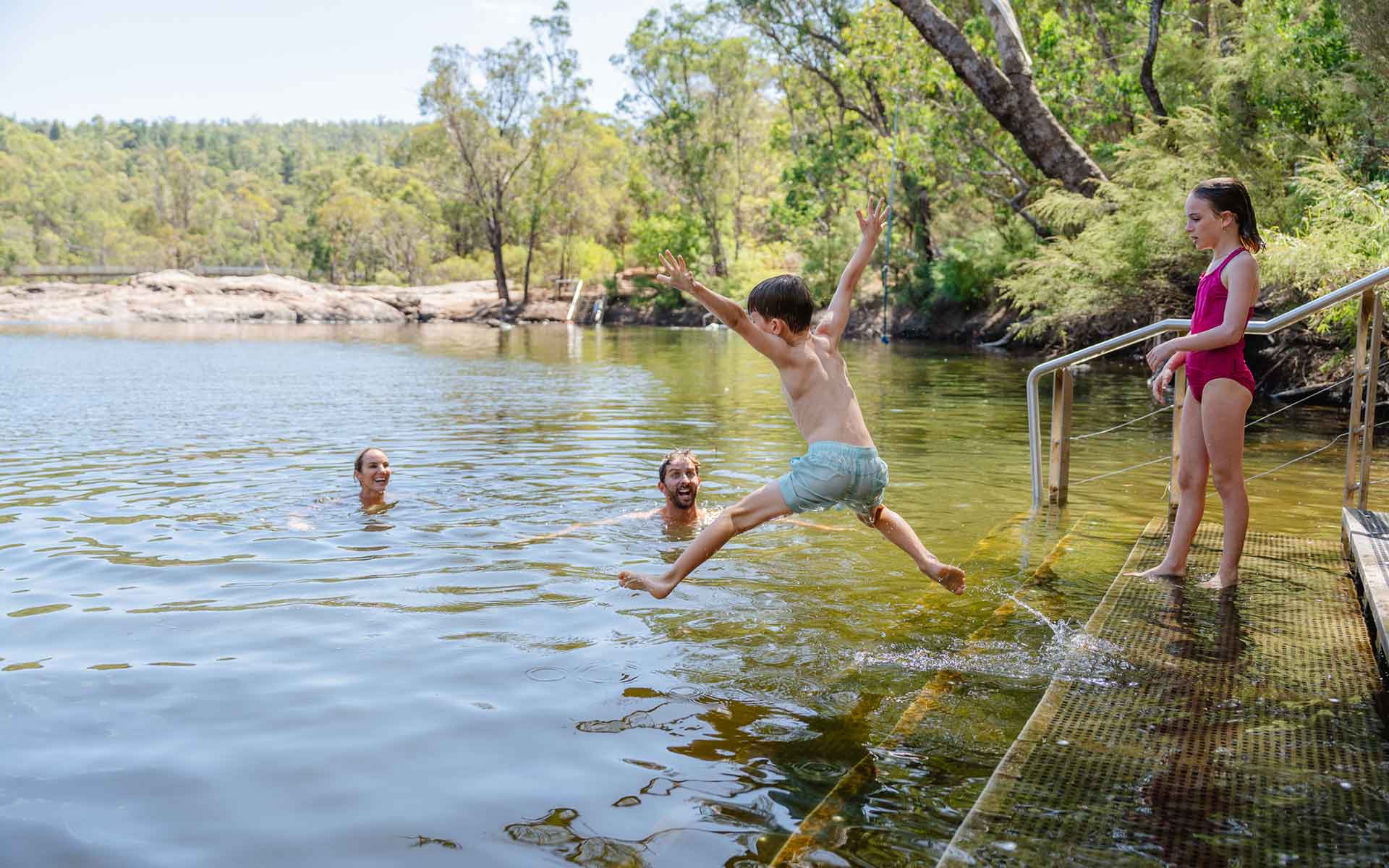 Family swimming in Lane Poole Reserve near Dwellingup